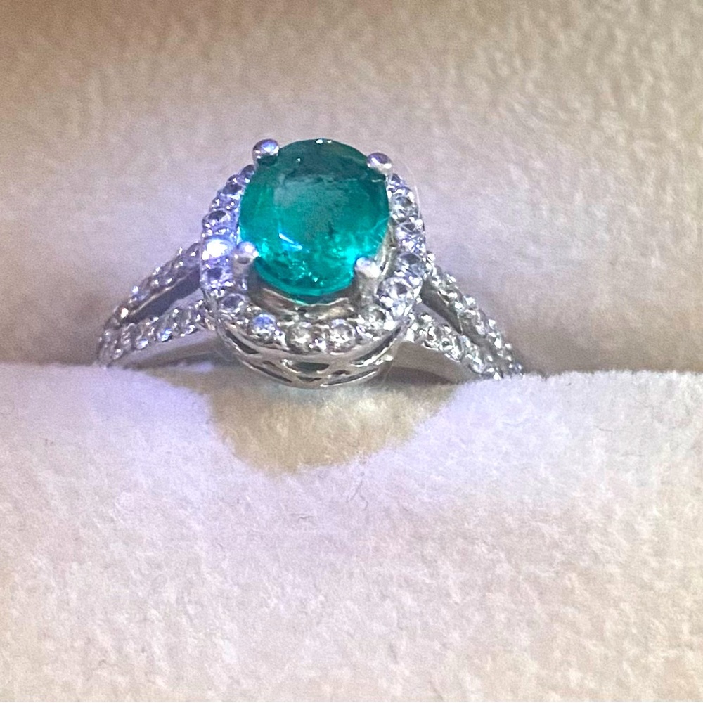 One Platinum Emerald $ Diamond Ring